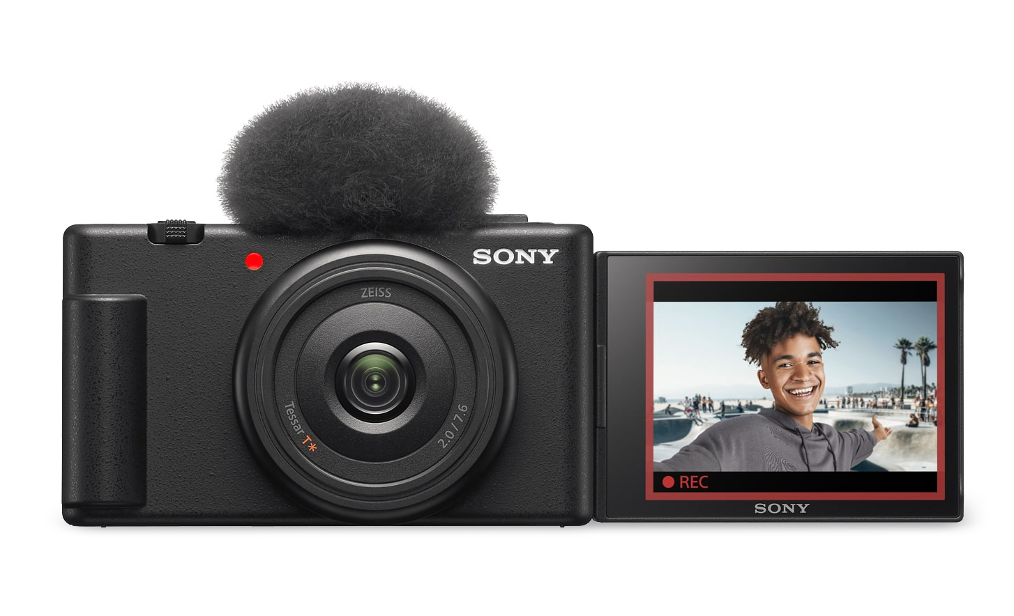 Imagine cu ZV-1F cu protecția la vânt atașată și ecranul deschis